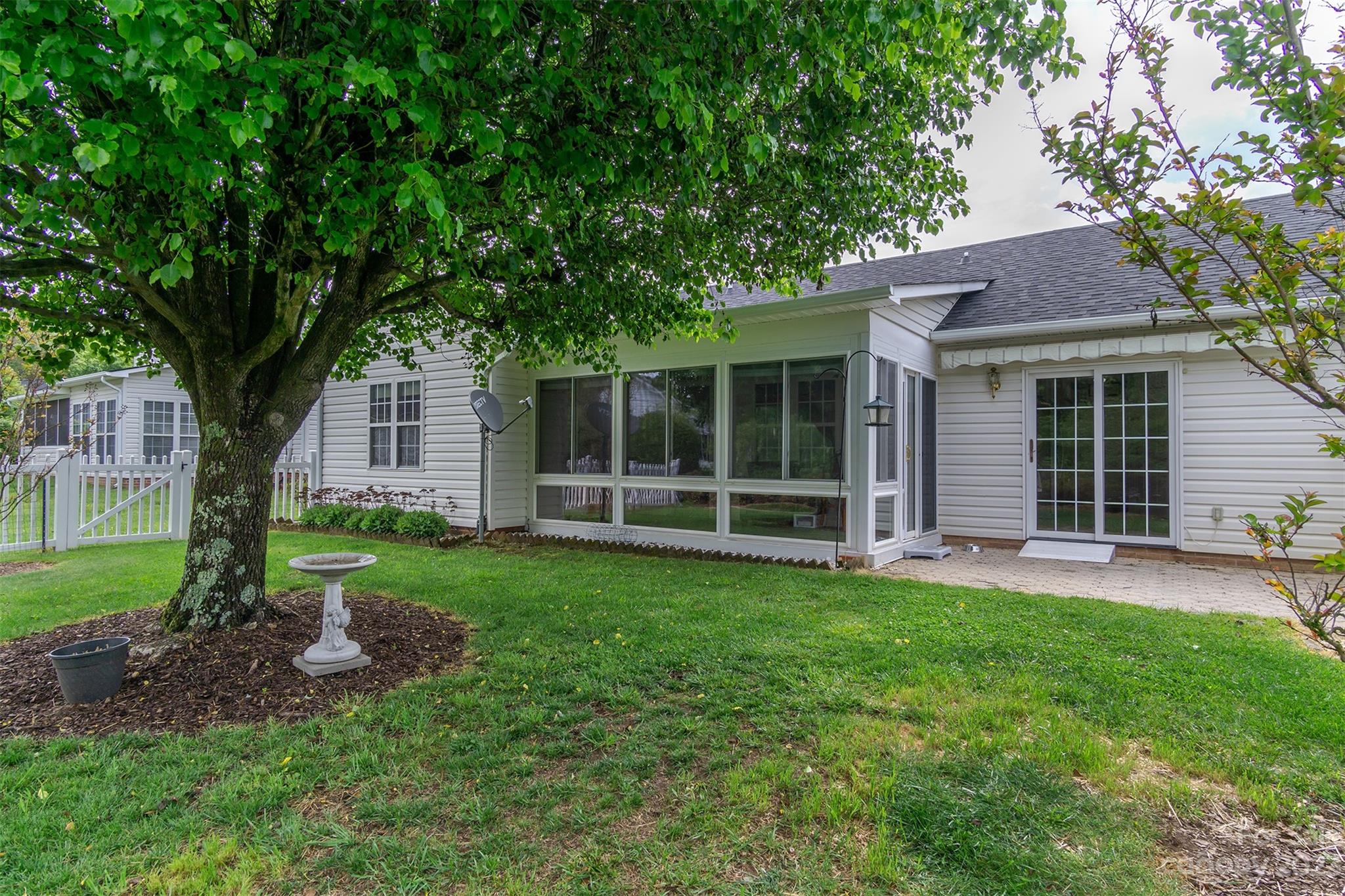 19 Briarbrook Road Fletcher, NC 28732 - Photo 4 of 46 a view of a house with a yard and large tree