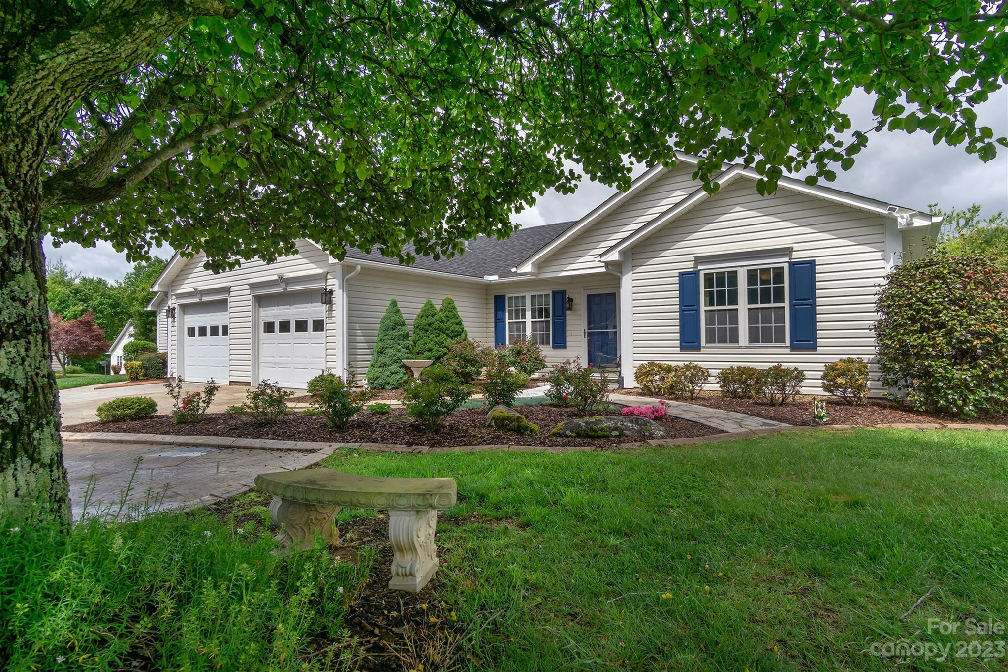 19 Briarbrook Road Fletcher, NC 28732 - Photo 5 of 46 a front view of a house with a yard and porch
