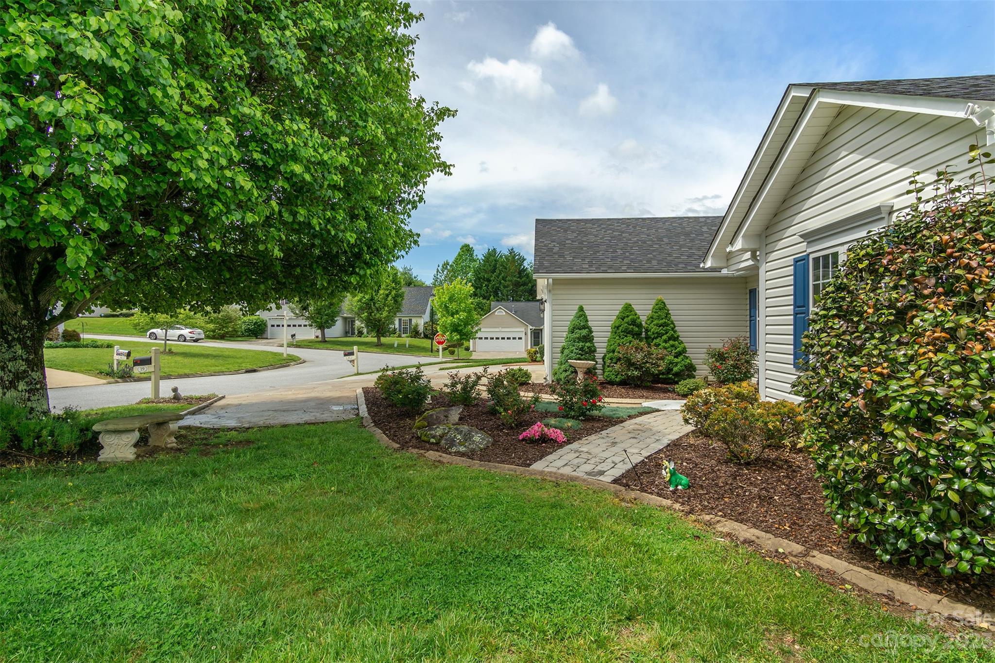 19 Briarbrook Road Fletcher, NC 28732 - Photo 8 of 46 a view of a garden with a slide