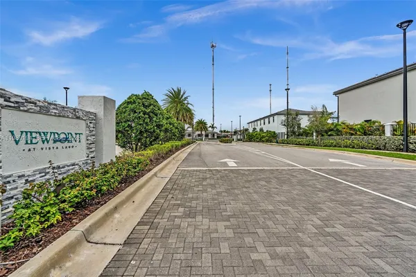 a view of a street with a building in the background