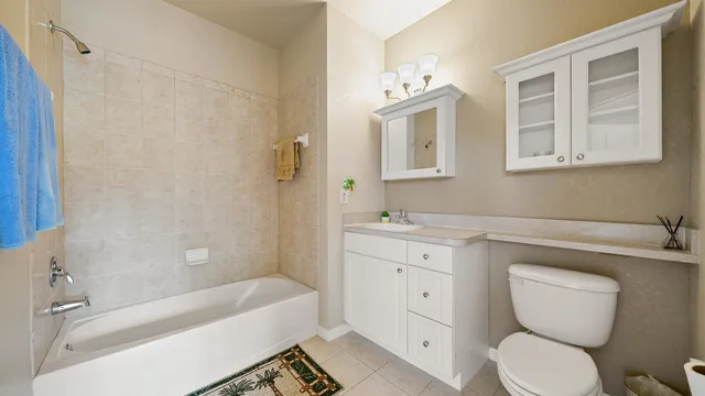a bathroom with a toilet sink and bathtub