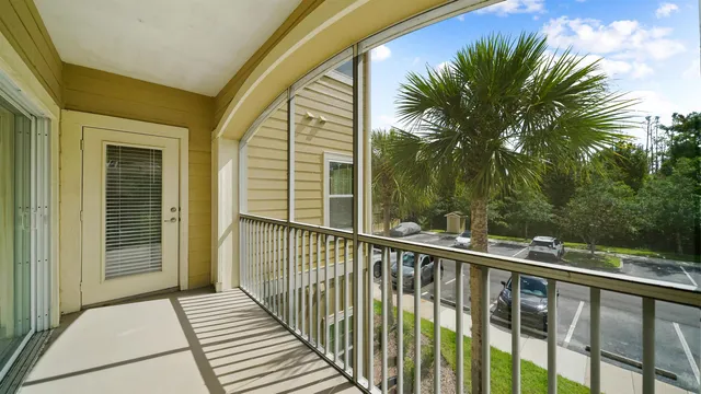 a balcony with view of outdoor space