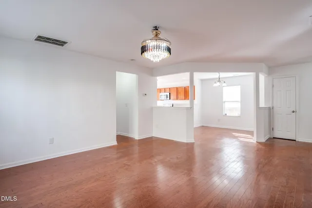 a kitchen with stainless steel appliances granite countertop a stove and a microwave