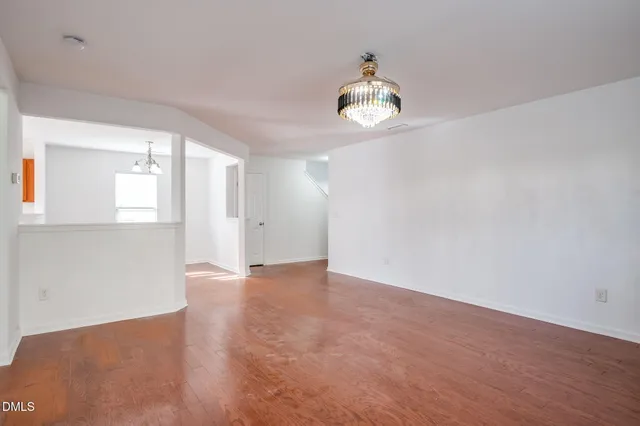 a kitchen with granite countertop stainless steel appliances sink microwave and stove