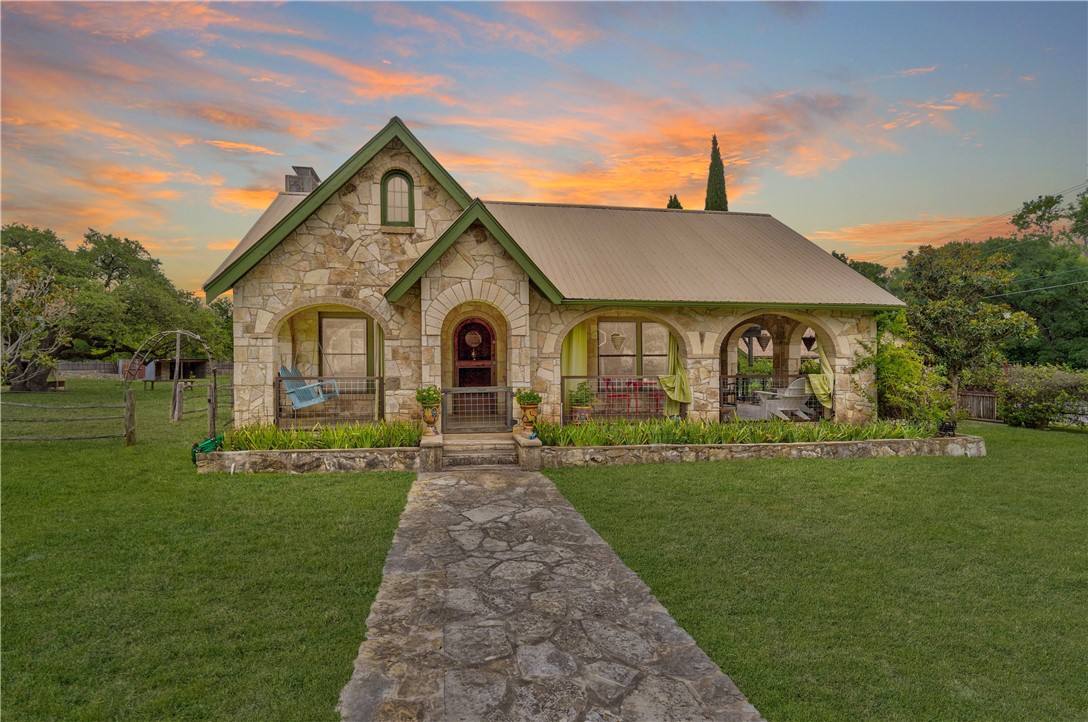 105 Creek Road Dripping Springs, TX 78620 - Photo 1 of 1 a front view of a house with a yard