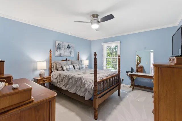 a bed room with bed and window