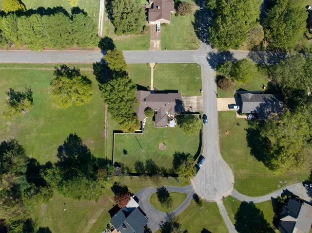 an aerial view of a house with a garden