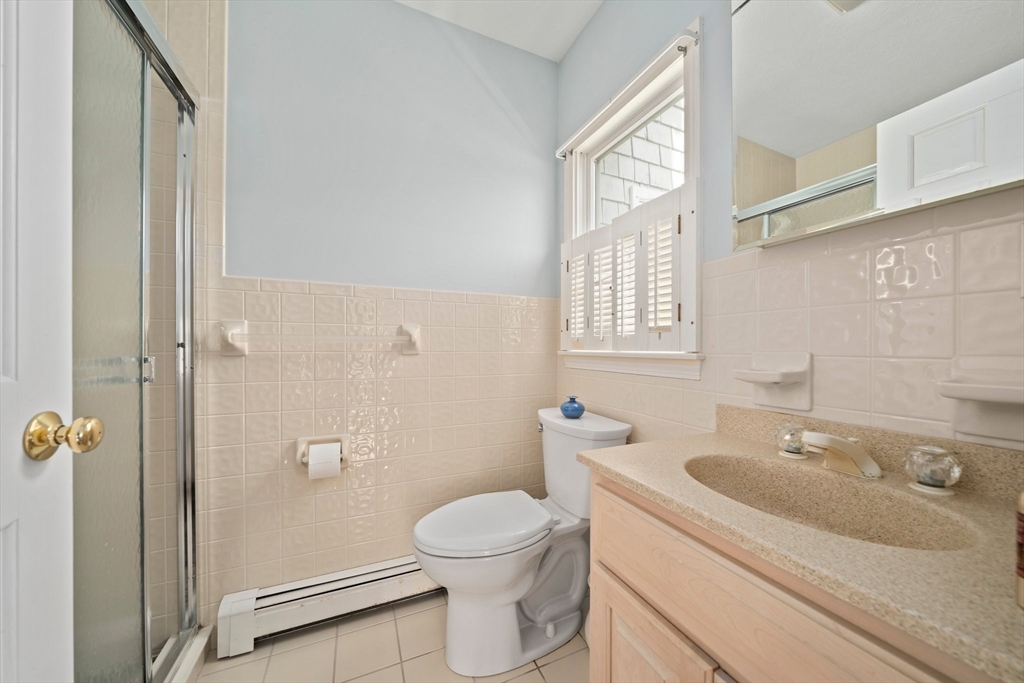 97 Central Avenue Scituate, MA 02050 - Photo 16 of 41 a bathroom with a sink toilet and shower