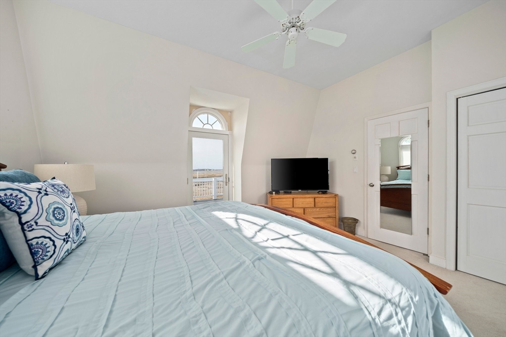 97 Central Avenue Scituate, MA 02050 - Photo 19 of 41 a bedroom with a bed and a flat screen tv