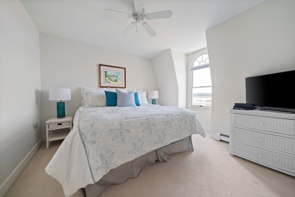 97 Central Avenue Scituate, MA 02050 - Photo 22 of 41 a bedroom with a bed and flat screen tv