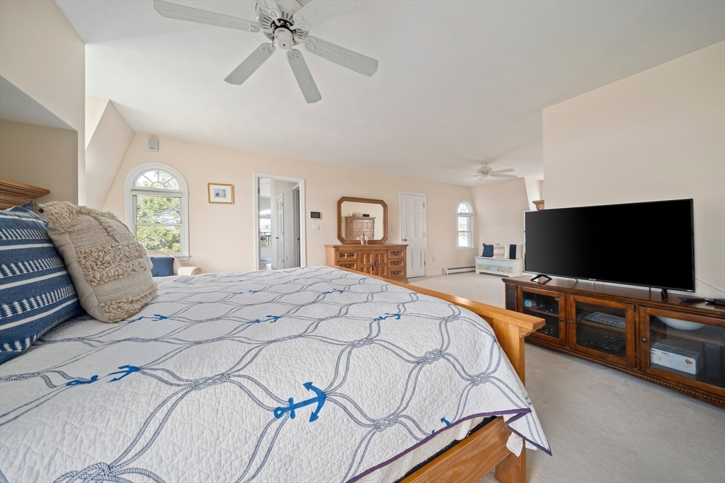 97 Central Avenue Scituate, MA 02050 - Photo 24 of 41 a bedroom with a bed and a flat screen tv