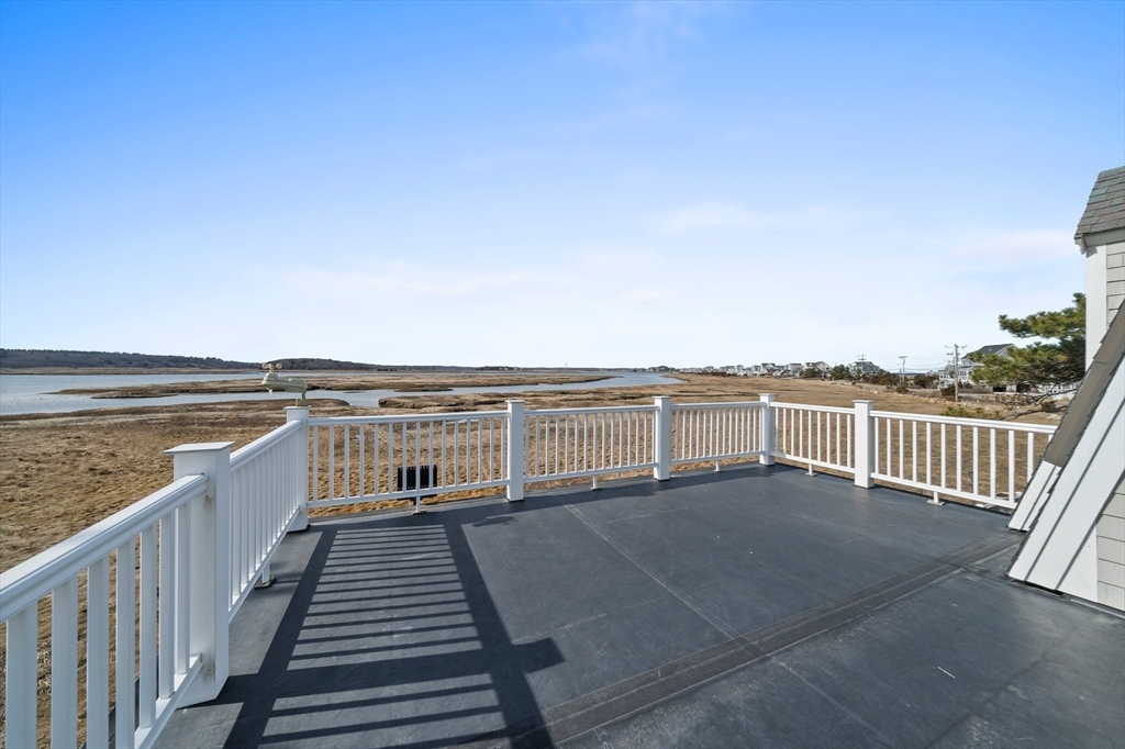 97 Central Avenue Scituate, MA 02050 - Photo 29 of 41 a view of a balcony with wooden floor and city view
