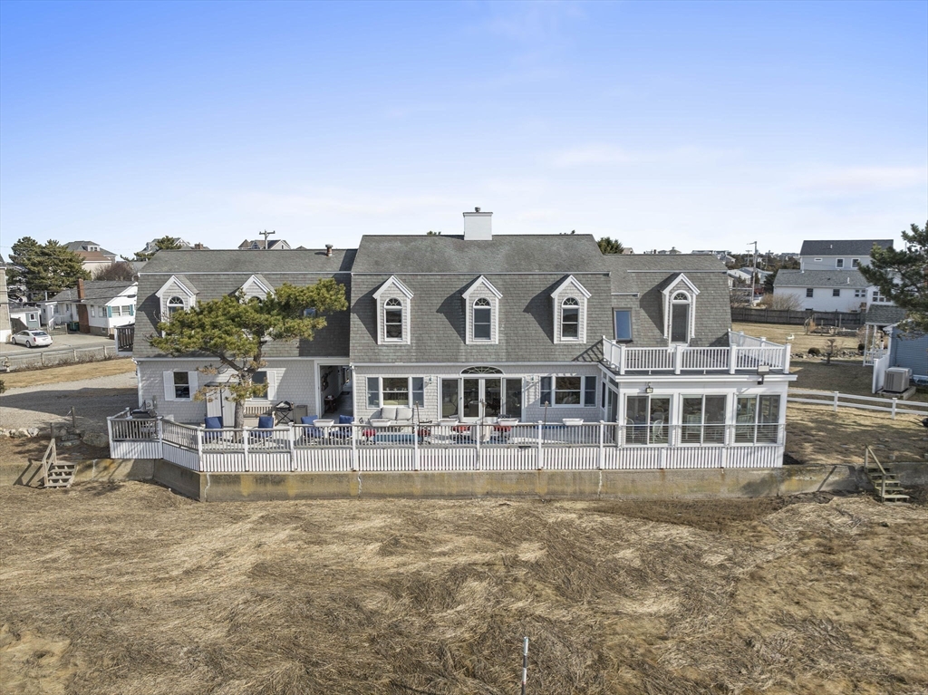 97 Central Avenue Scituate, MA 02050 - Photo 5 of 41 a view of a large building with a yard