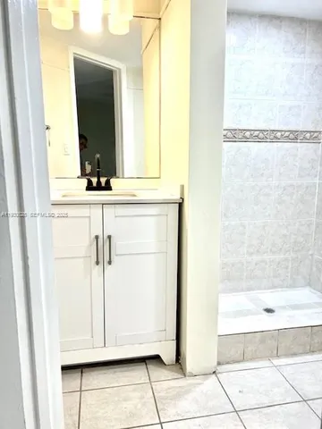 a bathroom with a bathtub and a sink