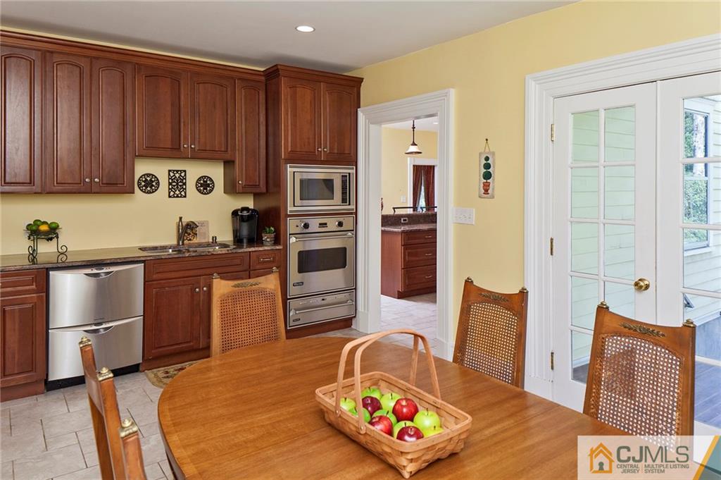 136 Mapleton Road Princeton, NJ 08540 - Photo 12 of 25 a kitchen with stainless steel appliances granite countertop a refrigerator sink and stove