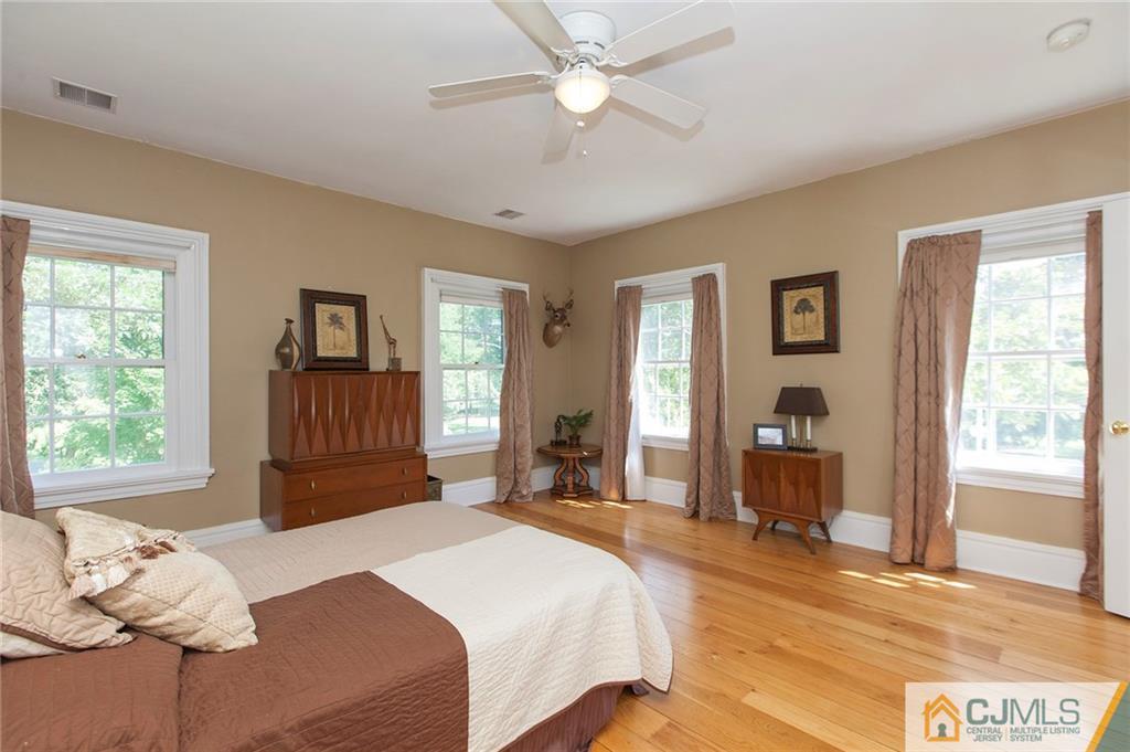 136 Mapleton Road Princeton, NJ 08540 - Photo 18 of 25 a bedroom with a large bed and a window