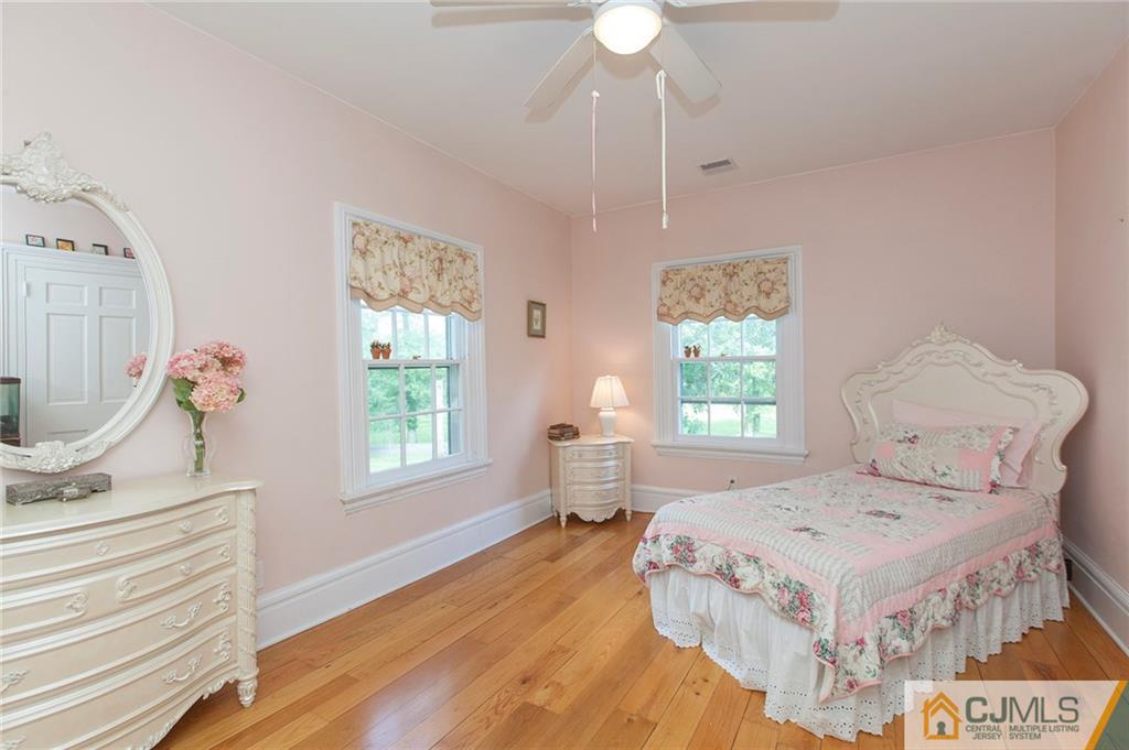 136 Mapleton Road Princeton, NJ 08540 - Photo 20 of 25 a spacious bedroom with a bed and a window
