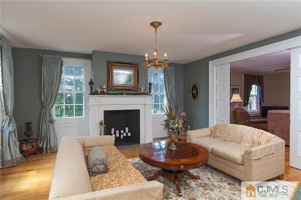 136 Mapleton Road Princeton, NJ 08540 - Photo 7 of 25 a living room with furniture and a fireplace