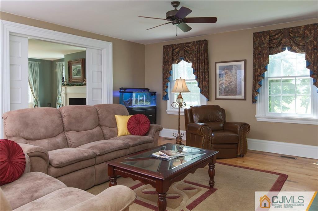 136 Mapleton Road Princeton, NJ 08540 - Photo 8 of 25 a living room with furniture ceiling fan and a window