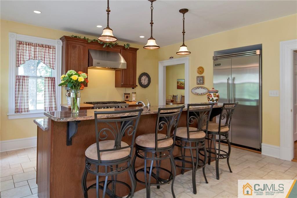 136 Mapleton Road Princeton, NJ 08540 - Photo 9 of 25 a view of a dining room with furniture and chandelier