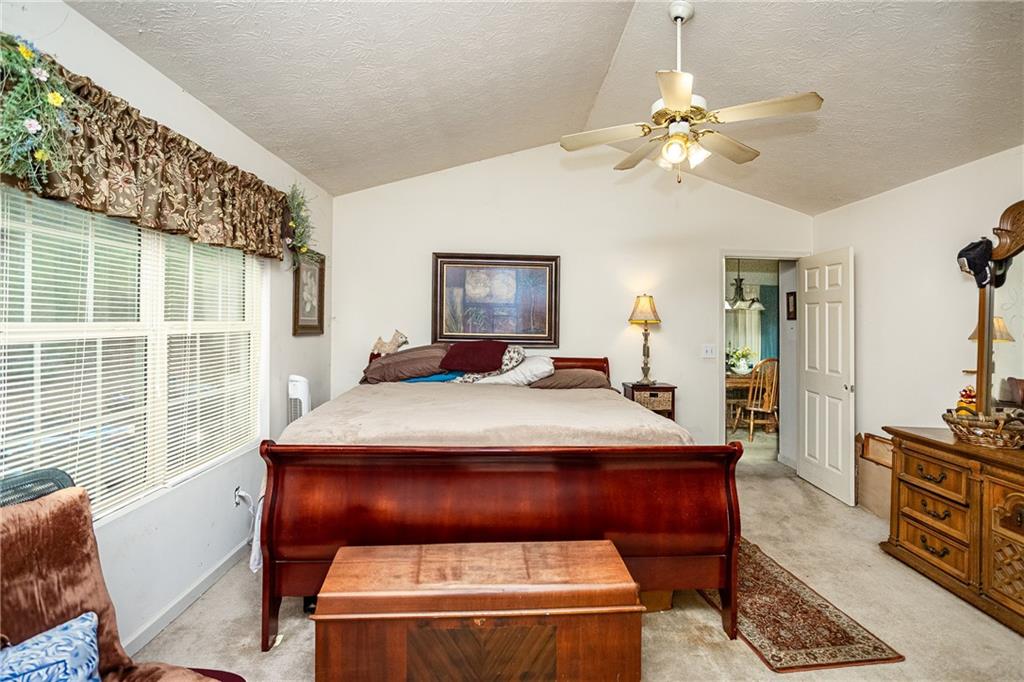 194 Cemetery Road Luthersville, GA 30251 - Photo 12 of 19 a bed sitting in a spacious bedroom next to a window