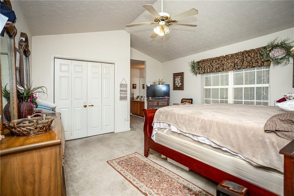 194 Cemetery Road Luthersville, GA 30251 - Photo 13 of 19 a bed room with a bed and a window