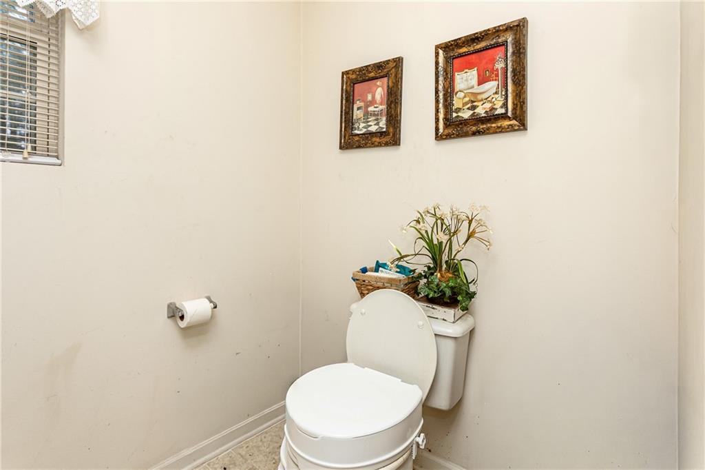194 Cemetery Road Luthersville, GA 30251 - Photo 15 of 19 a white toilet sitting next to a bathroom sink
