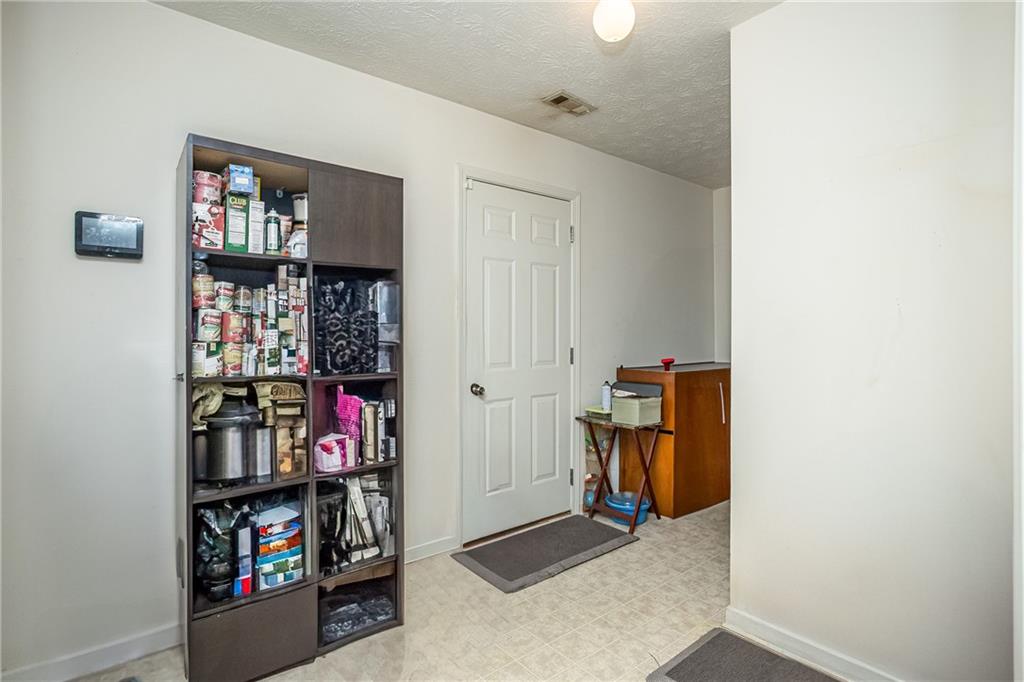 194 Cemetery Road Luthersville, GA 30251 - Photo 18 of 19 a room with storage and utility