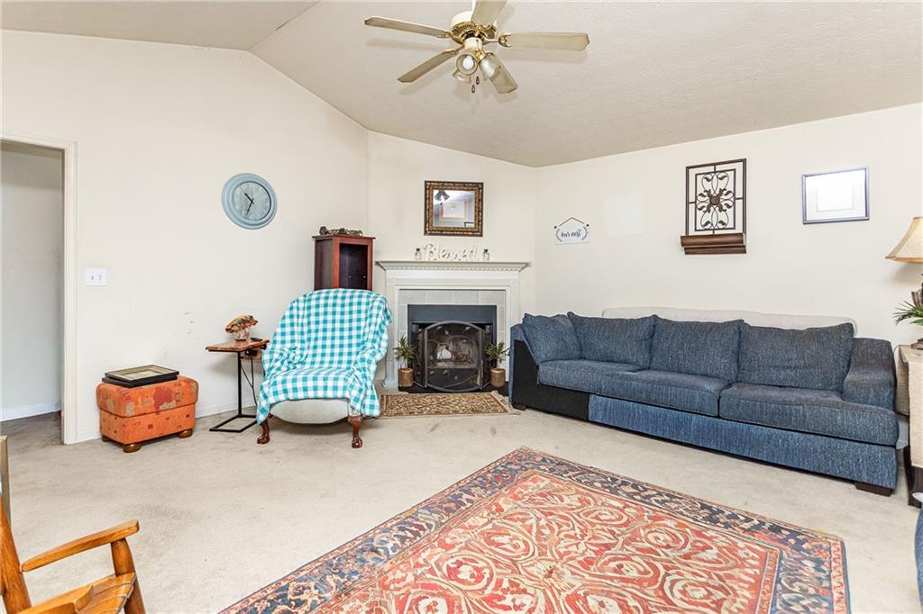194 Cemetery Road Luthersville, GA 30251 - Photo 5 of 19 a living room with furniture and a fireplace