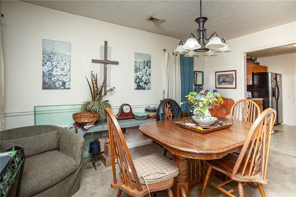 194 Cemetery Road Luthersville, GA 30251 - Photo 8 of 19 a view of a dining room with furniture