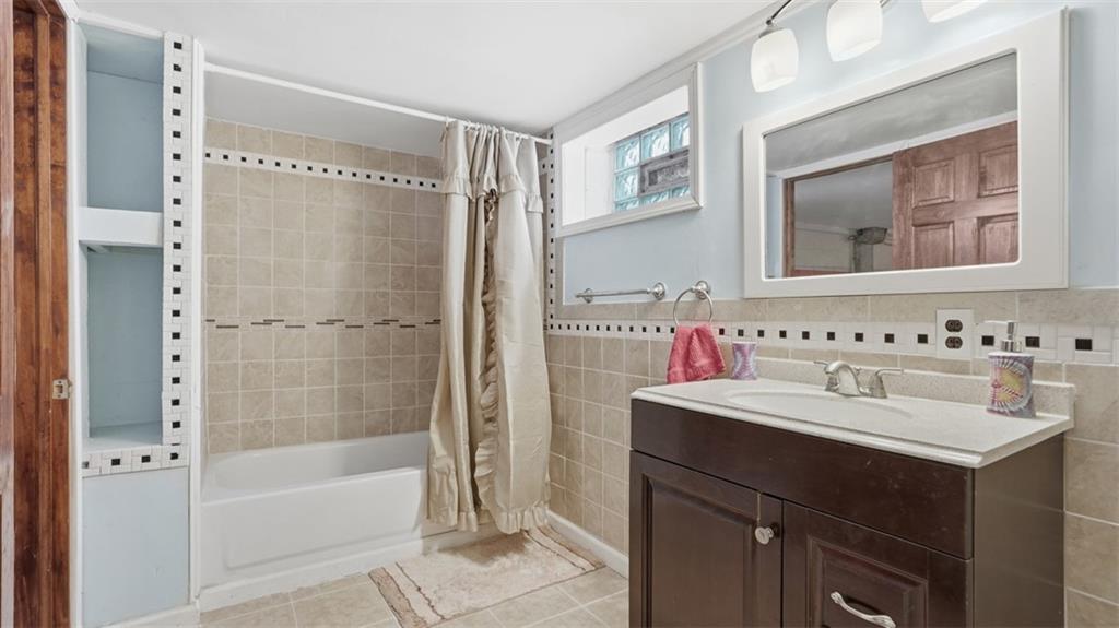 2129 Admiral Street Aliquippa, PA 15001 - Photo 24 of 34 a bathroom with a sink mirror toilet and bathtub