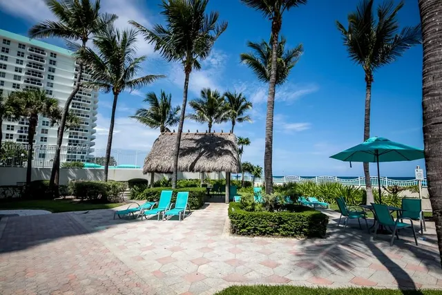 a view of a swimming pool with a patio