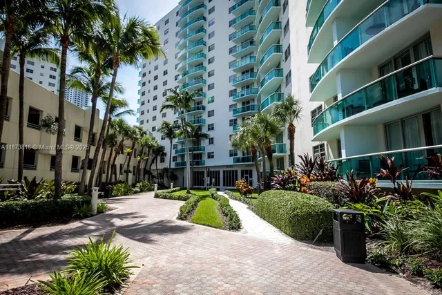 a view of a livingroom with furniture and a window