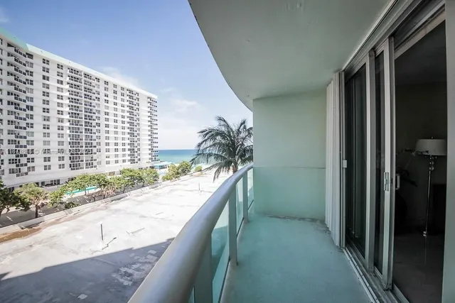 a view of balcony with furniture