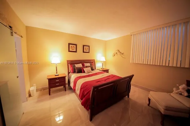 a view of walk in closet with clothes