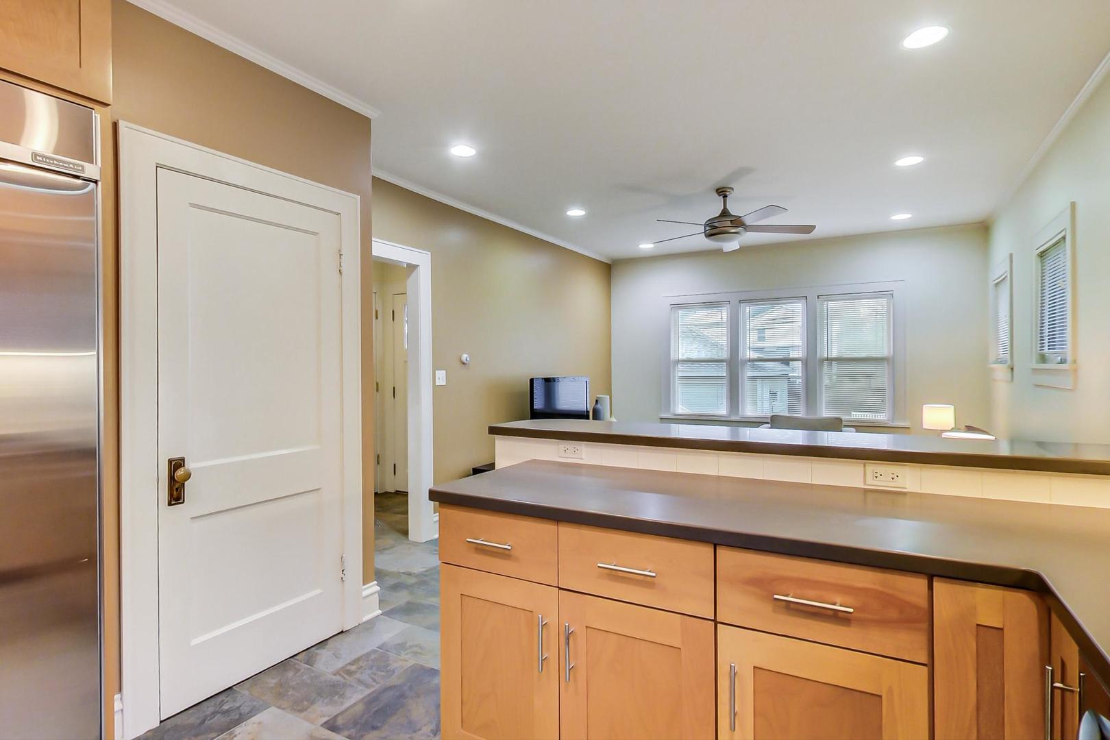 205 East Quincy Street Riverside, IL 60546 - Photo 14 of 46 a view of a kitchen from a hallway