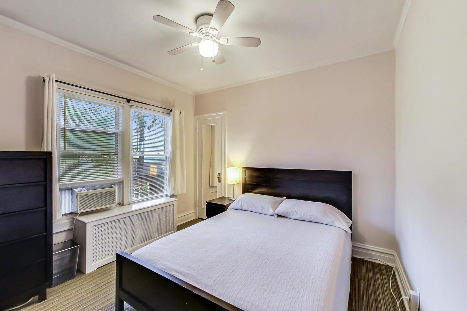 205 East Quincy Street Riverside, IL 60546 - Photo 22 of 46 a bedroom with a large bed and a window