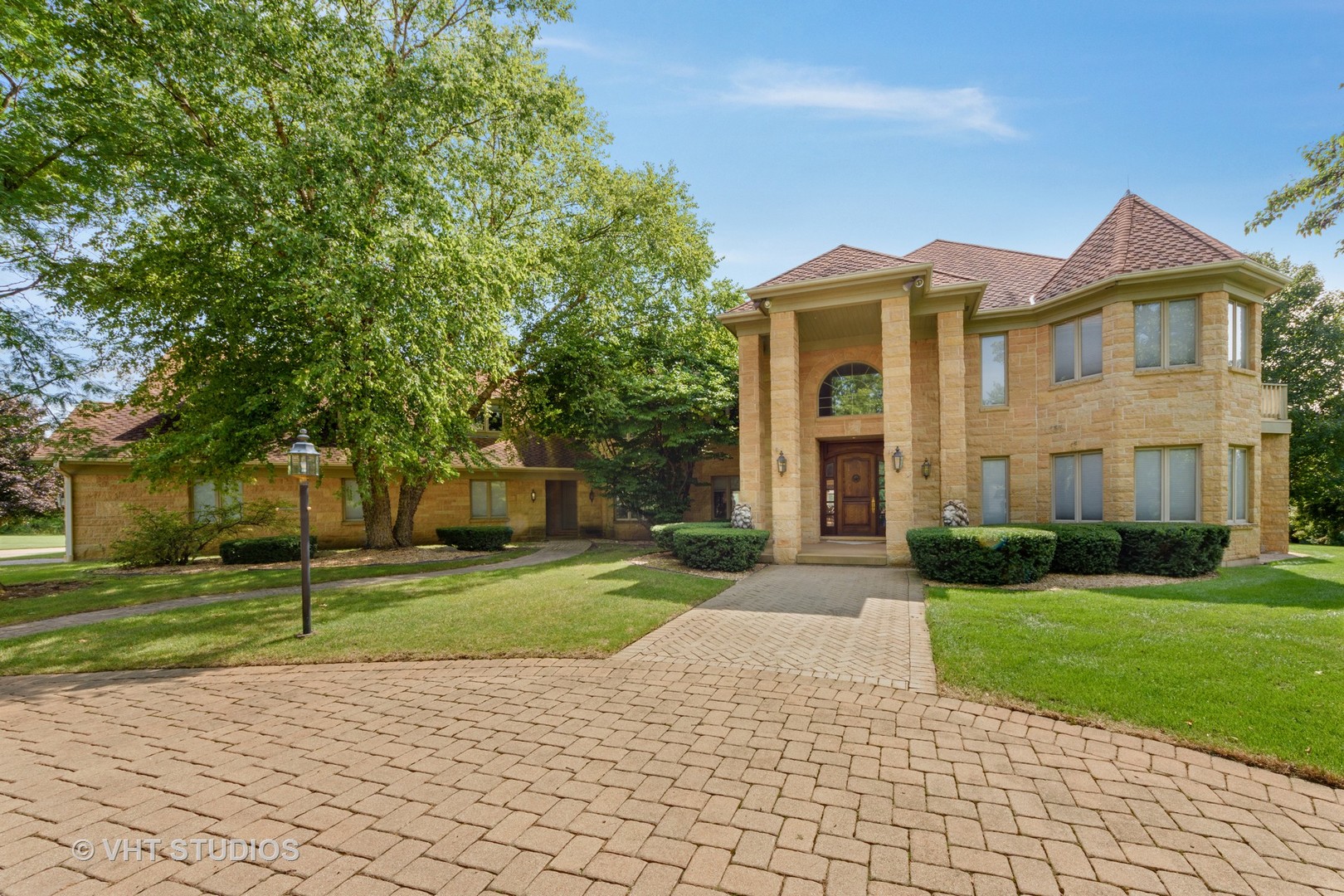 215 West Dundee Road Barrington, IL 60010 - Photo 1 of 34 a front view of a house with a yard