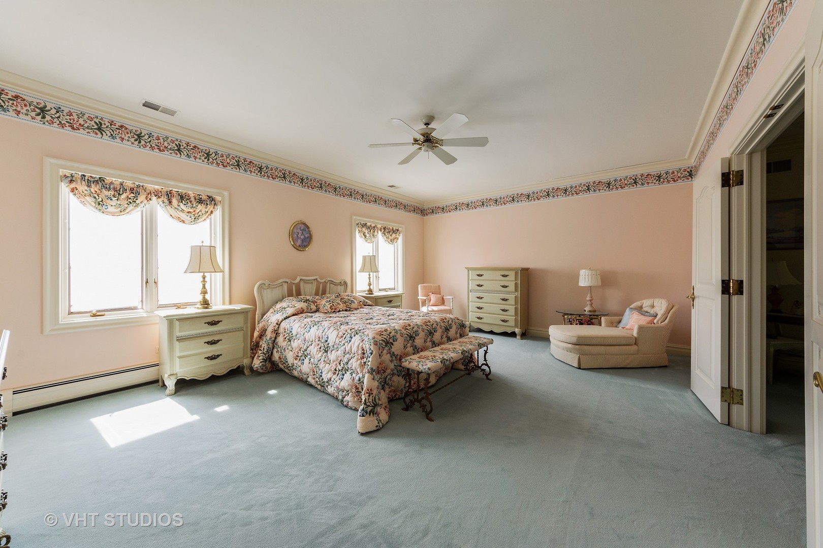 215 West Dundee Road Barrington, IL 60010 - Photo 22 of 34 a bedroom with furniture and a chandelier