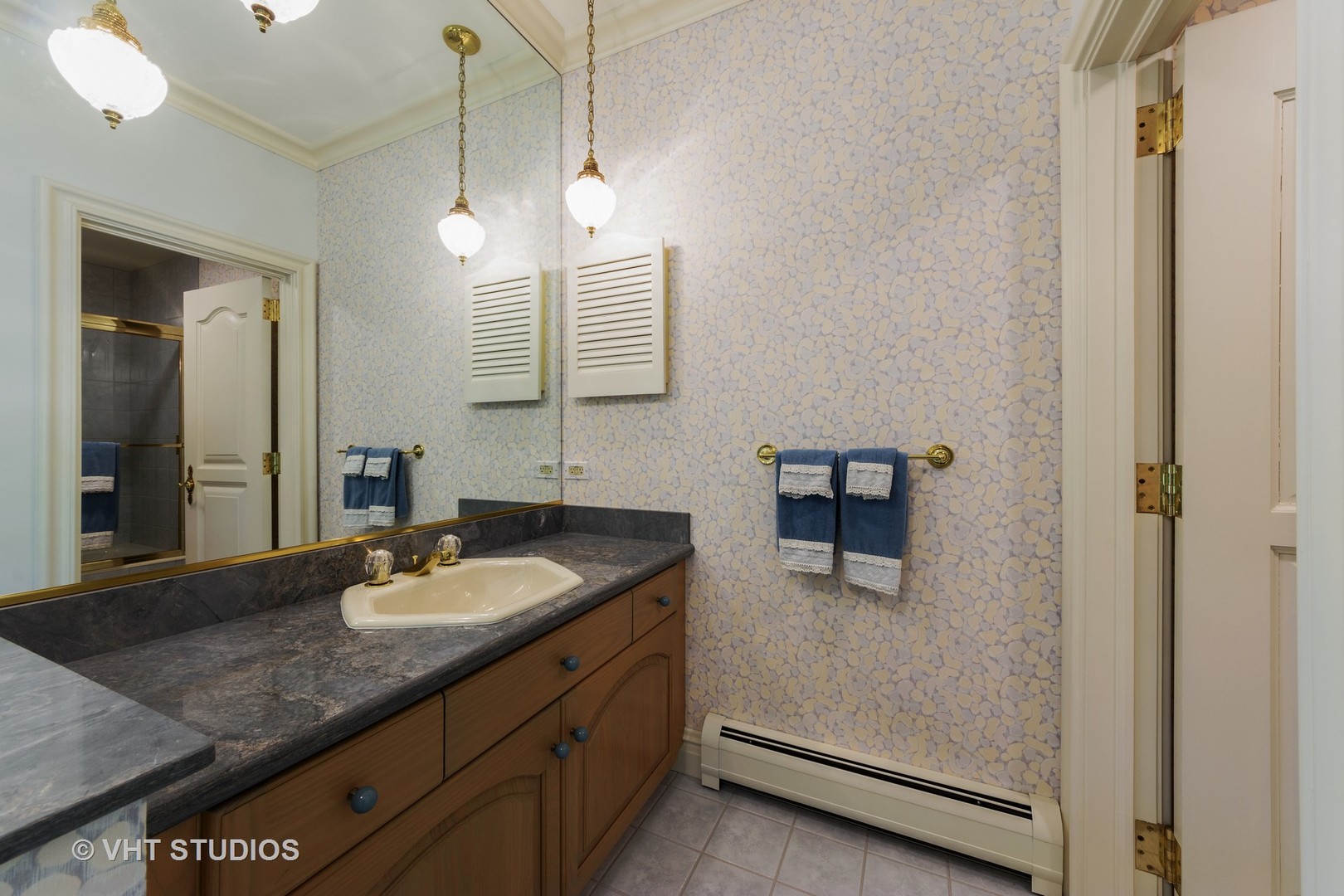 215 West Dundee Road Barrington, IL 60010 - Photo 26 of 34 a bathroom with a granite countertop sink and a mirror
