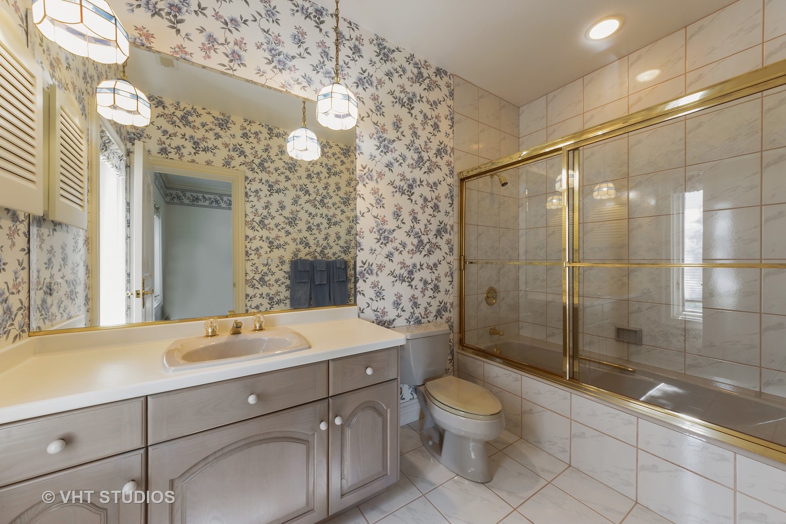 215 West Dundee Road Barrington, IL 60010 - Photo 27 of 34 a bathroom with a shower sink vanity mirror and toilet