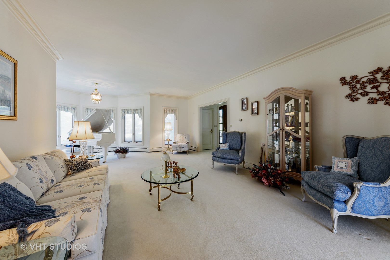 215 West Dundee Road Barrington, IL 60010 - Photo 5 of 34 a living room with furniture and a chandelier