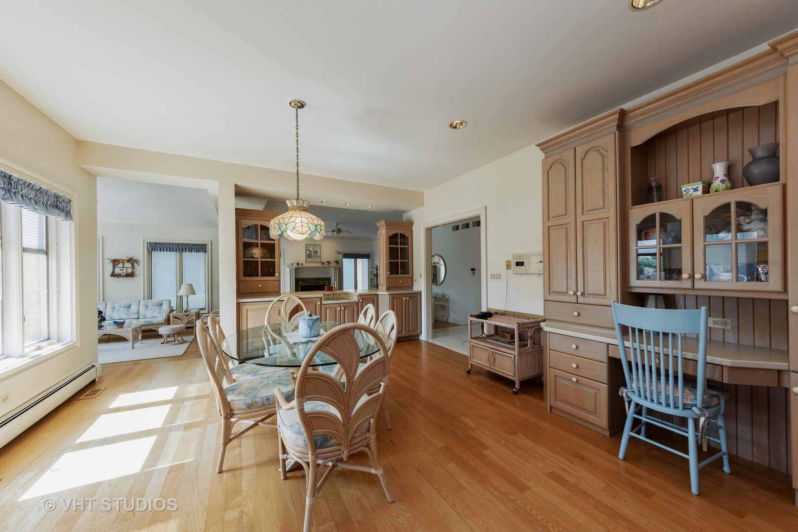 215 West Dundee Road Barrington, IL 60010 - Photo 9 of 34 a living room with furniture a dining table and a chandelier