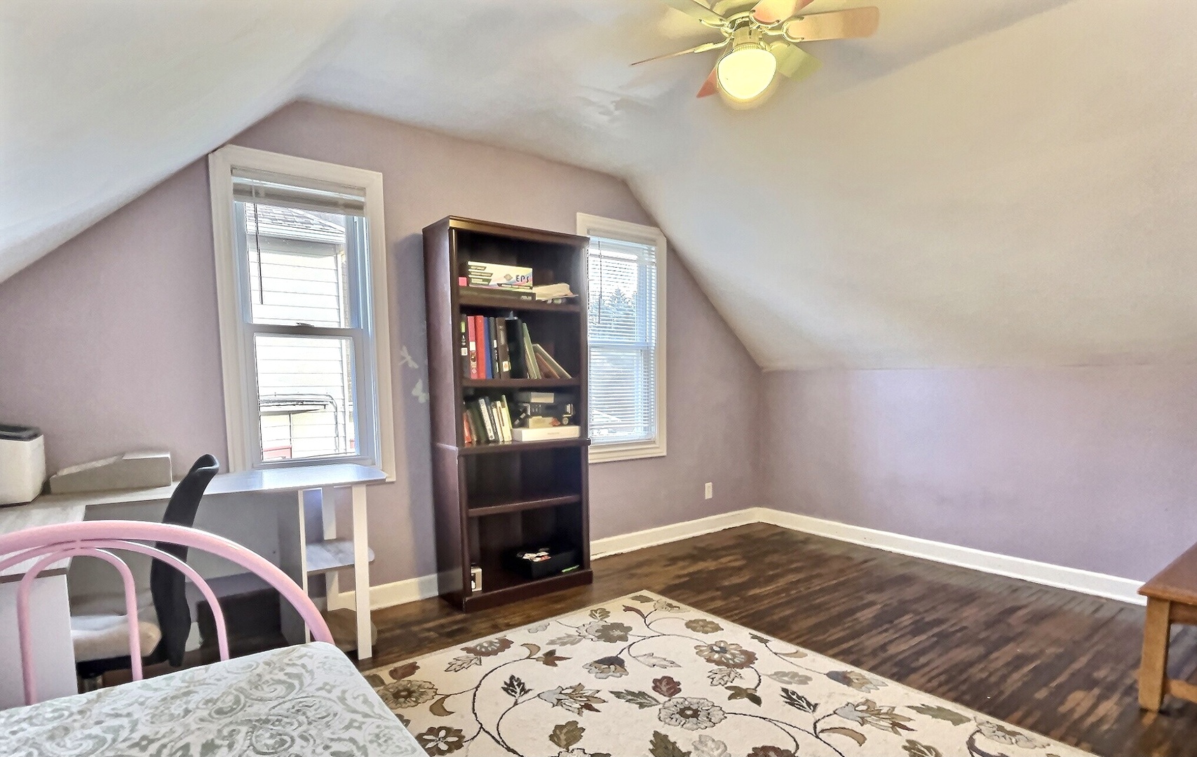 712 South 4th Street DeKalb, IL 60115 - Photo 12 of 25 a bedroom with a bed and window