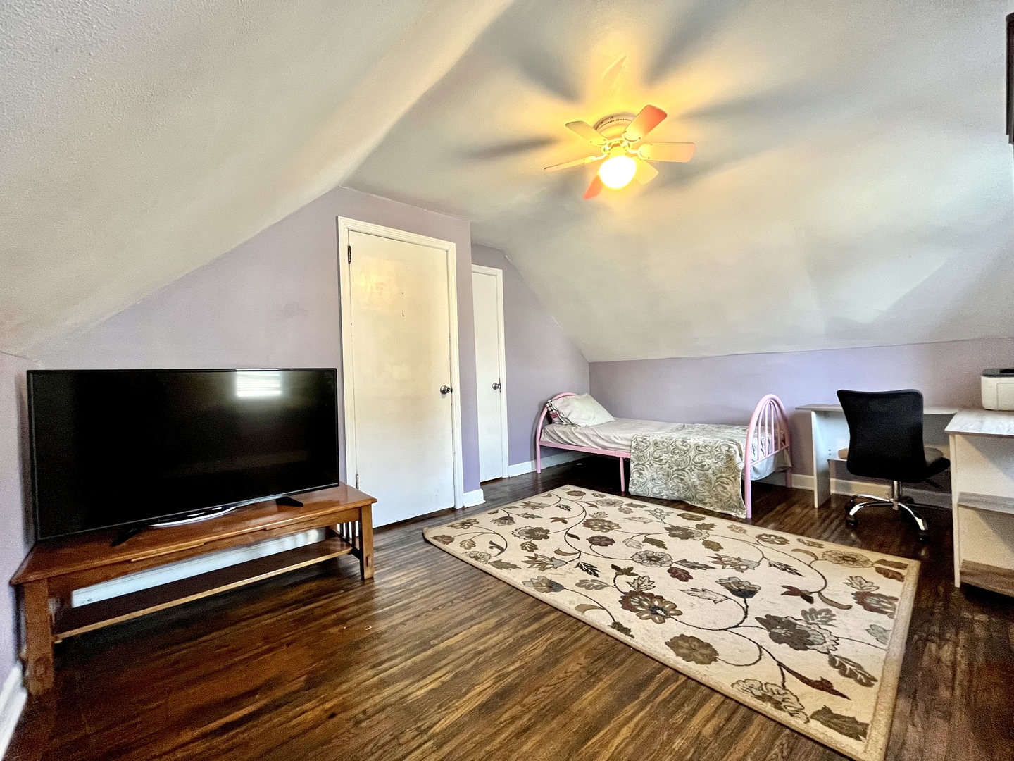 712 South 4th Street DeKalb, IL 60115 - Photo 13 of 25 a bedroom with a bed and a flat screen tv