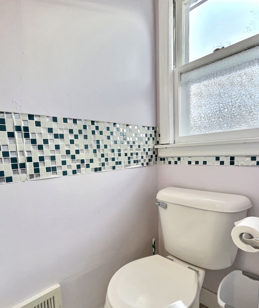 712 South 4th Street DeKalb, IL 60115 - Photo 17 of 25 a white toilet sitting next to a window