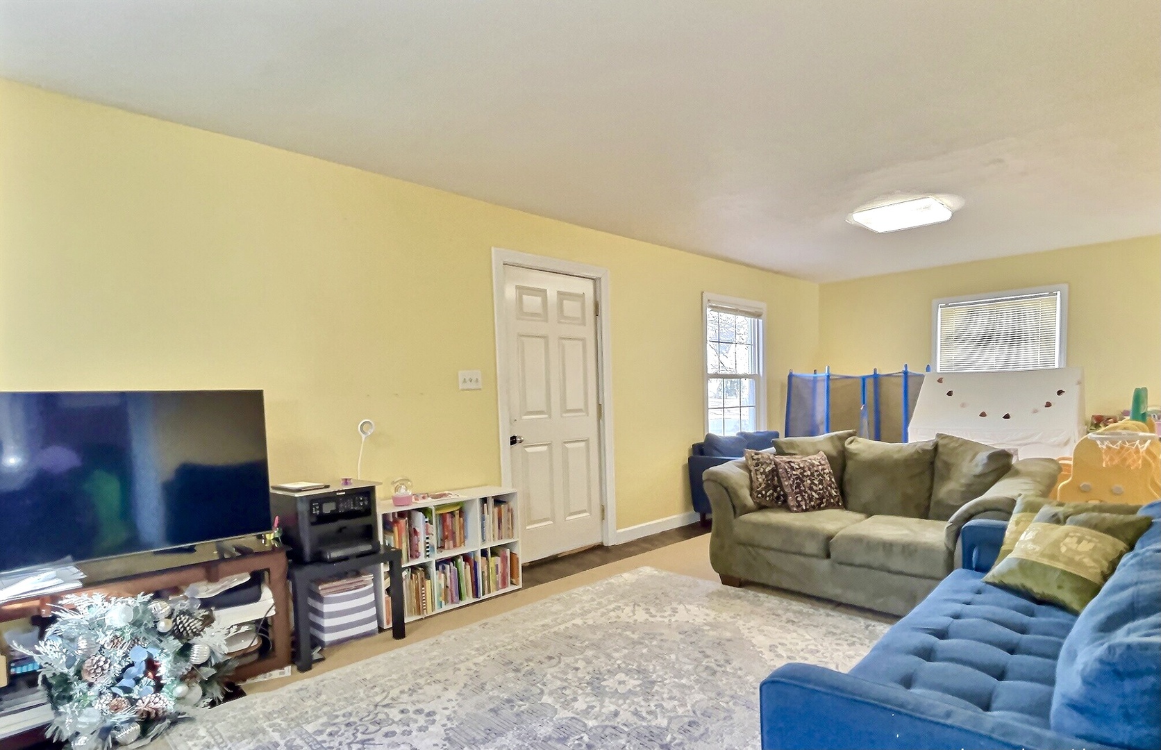 712 South 4th Street DeKalb, IL 60115 - Photo 8 of 25 a living room with furniture and a flat screen tv