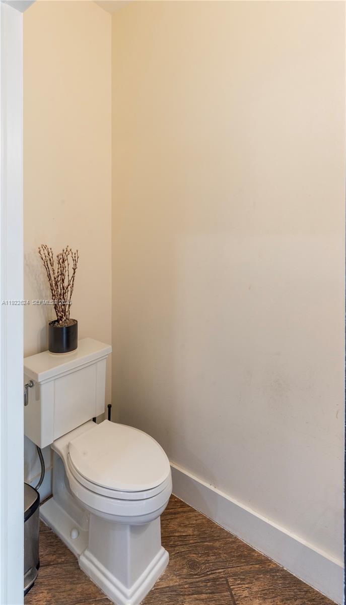 13276 Southwest 128th Street Miami, FL 33186 - Photo 12 of 27 a bathroom with a toilet and a view of bathroom