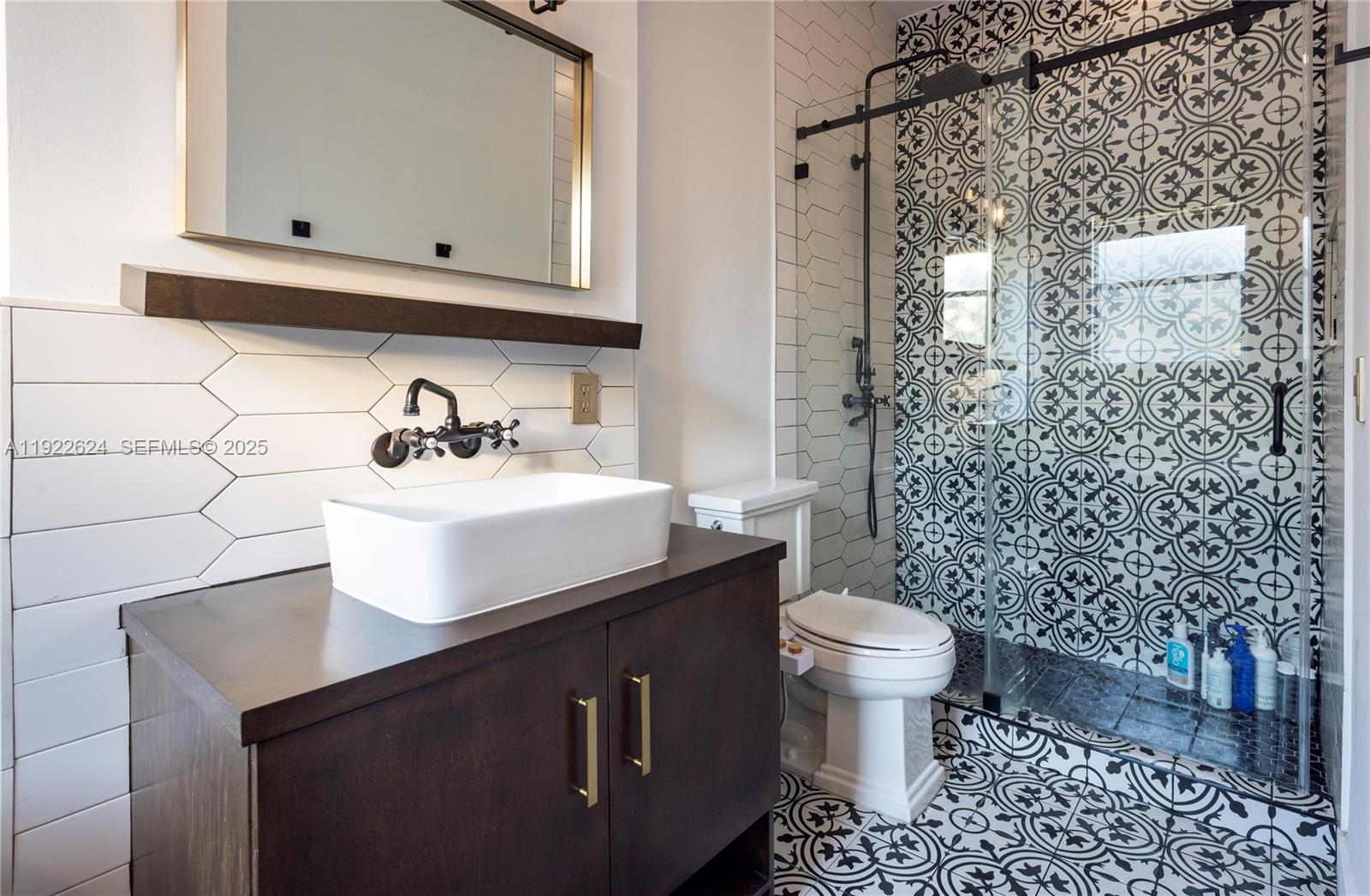 13276 Southwest 128th Street Miami, FL 33186 - Photo 20 of 27 a bathroom with a sink toilet and mirror