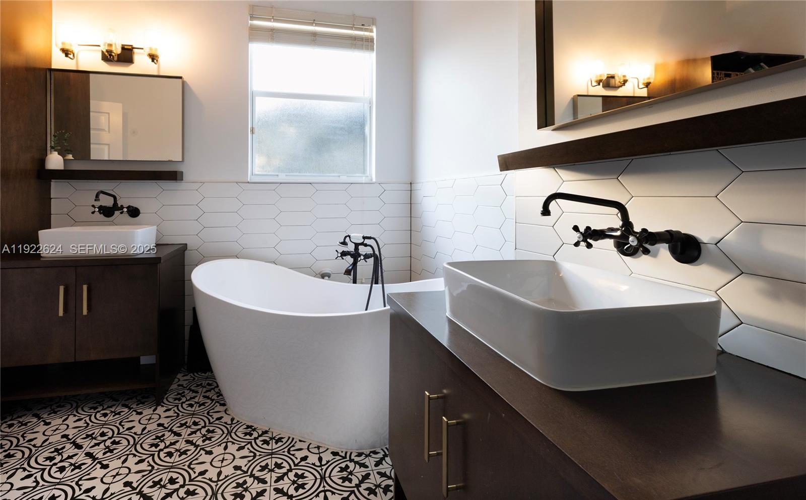 13276 Southwest 128th Street Miami, FL 33186 - Photo 21 of 27 a bathroom with a sink and a mirror